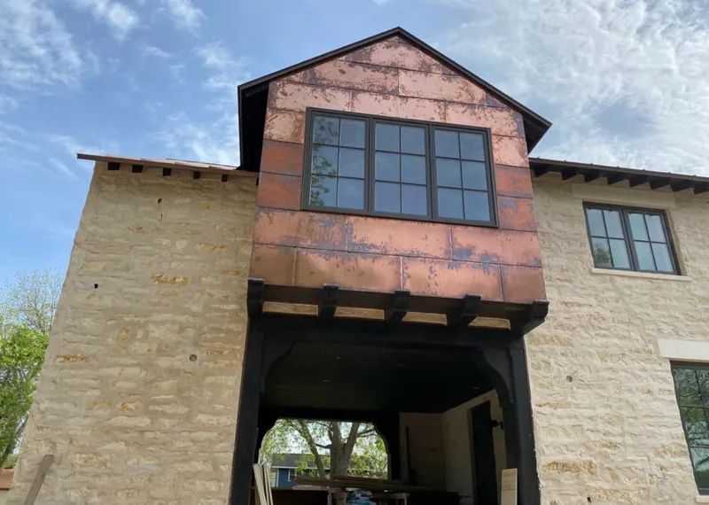 Copper metal panel facade on a stone building for Skylight Installation in Acworth