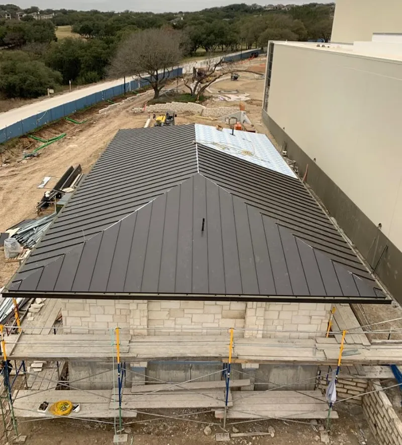 Metal roof new construction with scaffolding in Acworth
